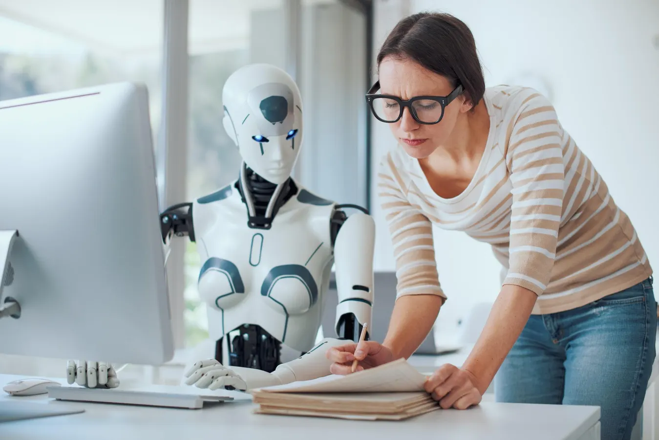 A professional using an AI assistant on a computer to build practical AI skills.